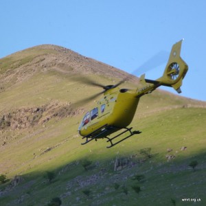 The air ambulance taking off in front of Lingmell Nose