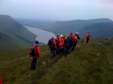 Carrying the stretcher across to Lingmell Nose