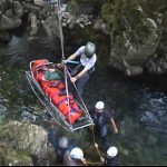 Stretcher and casualty being hoisted out of the gorge