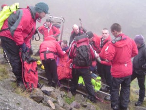 Team members treat the casualty Team members treat the casualty