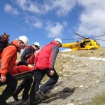 Carrying one of the casualties up to the waiting RAF Sea King