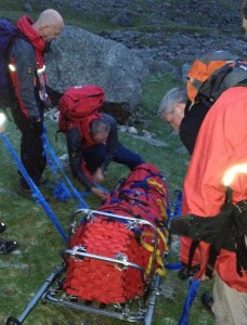Stretcher loaded, last minute checks before the descent