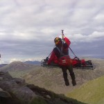 The casualty and winchman being winched into the helicopter