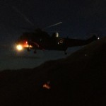 The stretcher is winched into the Sea King