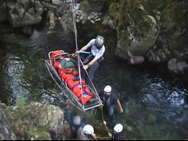 Stretcher and casualty being hoisted out of the gorge