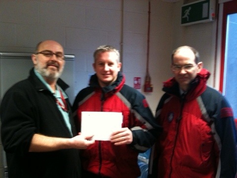 Mike and Paul receiving the donation from the B500 team
