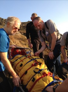 Checking the casualty is comfortable before the descent to Birkerthwaite