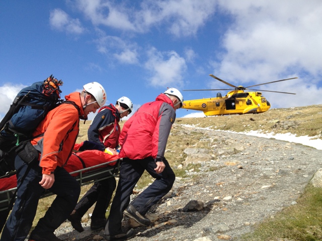 Carrying one of the casualties up to the waiting RAF Sea King